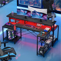 Bestier 71.5 Gaming Desk with Power Outlet, L-Shaped Computer Desk with Monitor Stand, Corner Gamer Table with Adjustable shelf & Headphone hook